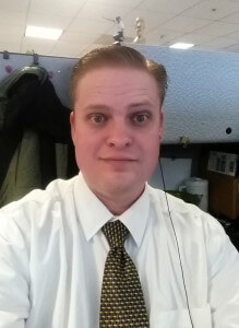2015-02-26 - Hey, every one of these has to have a selfie right? Yes I wear a tie to work every day. Yes that's a Napoleon Dynamite figurine, it talks.