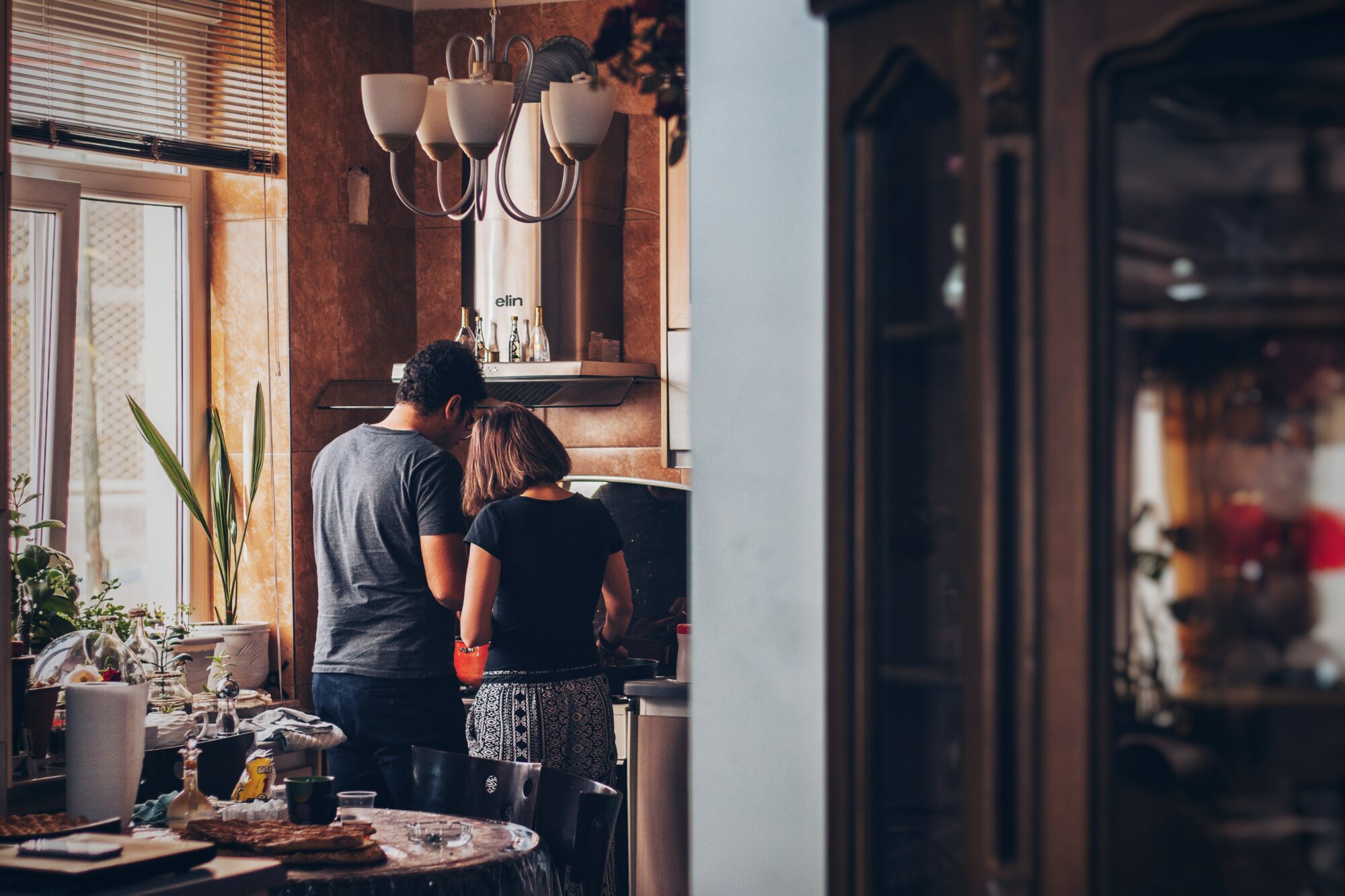 couple cooking in kitchen