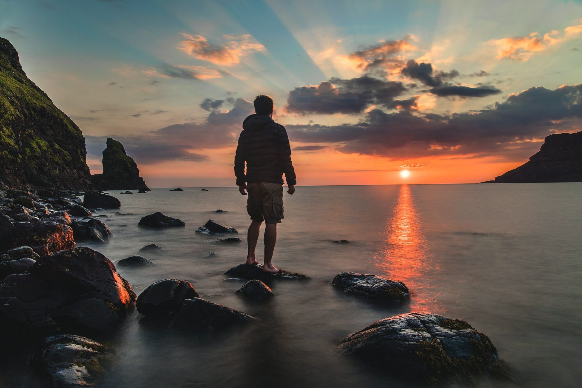 person standing on rock