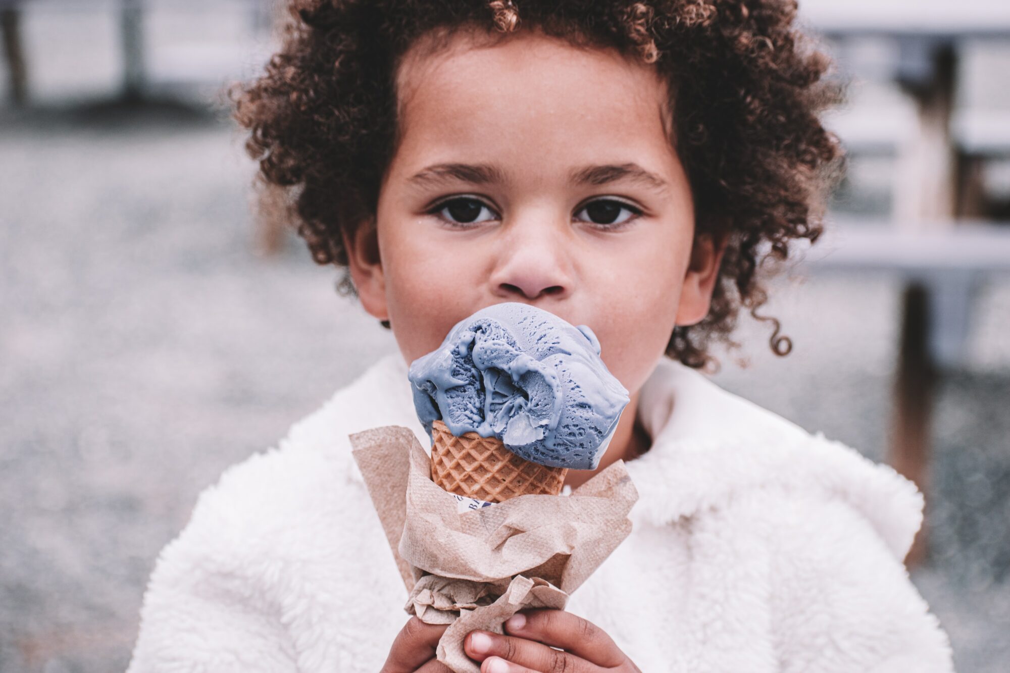 child holding ice cream