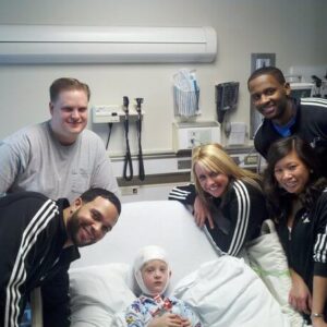 Chris with child at hospital
