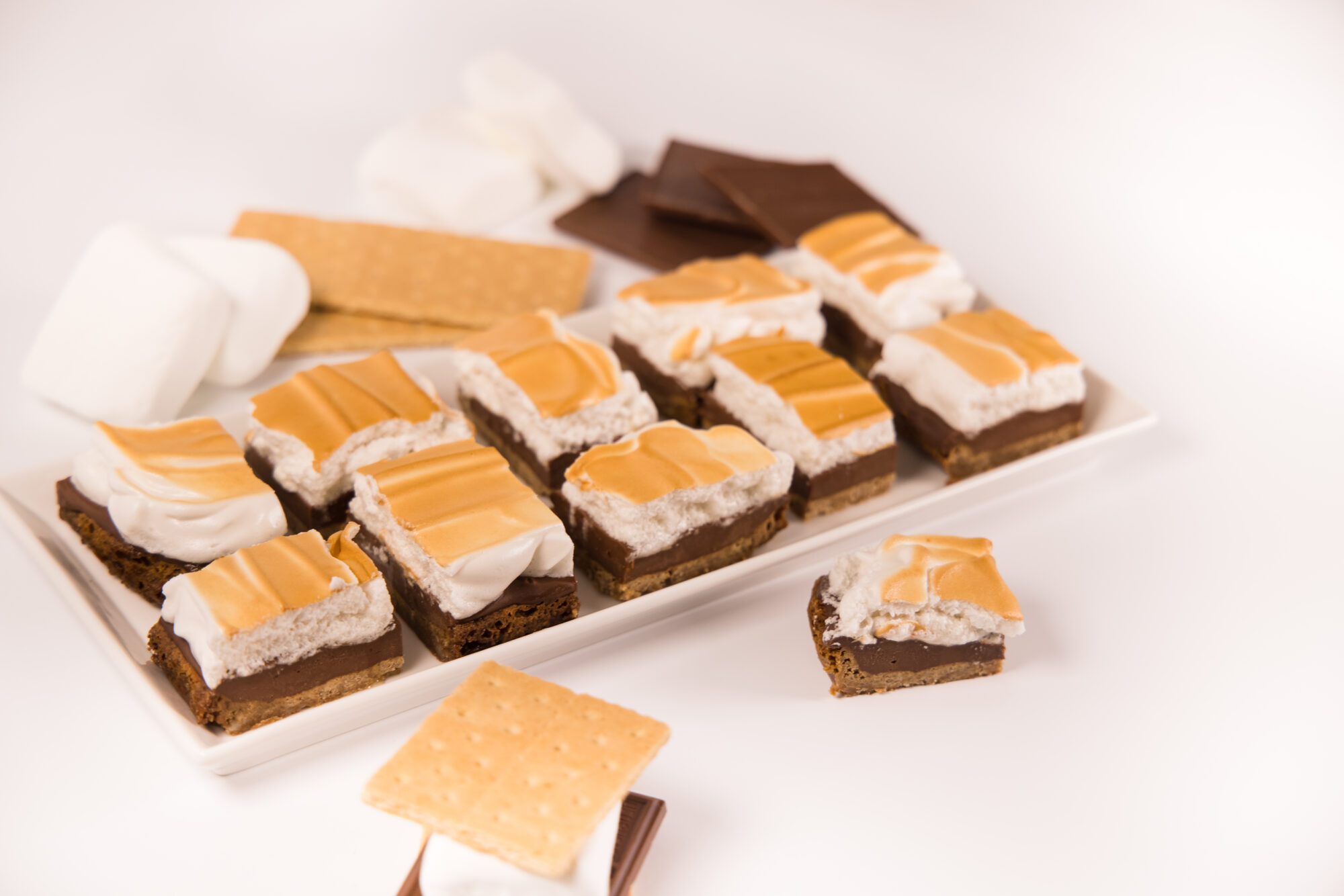 White tray filled with individual S'mores.