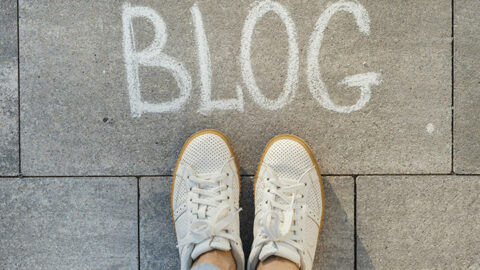 Photo of a sidewalk with the word "Blog" written on it in chalk