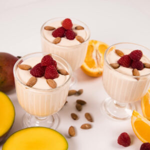 orange mango yogurt with raspberries- featuring orange mango keto chow