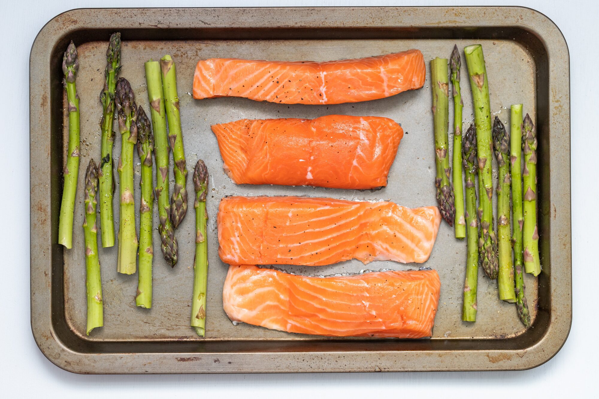 salmon and asparagus on a tray