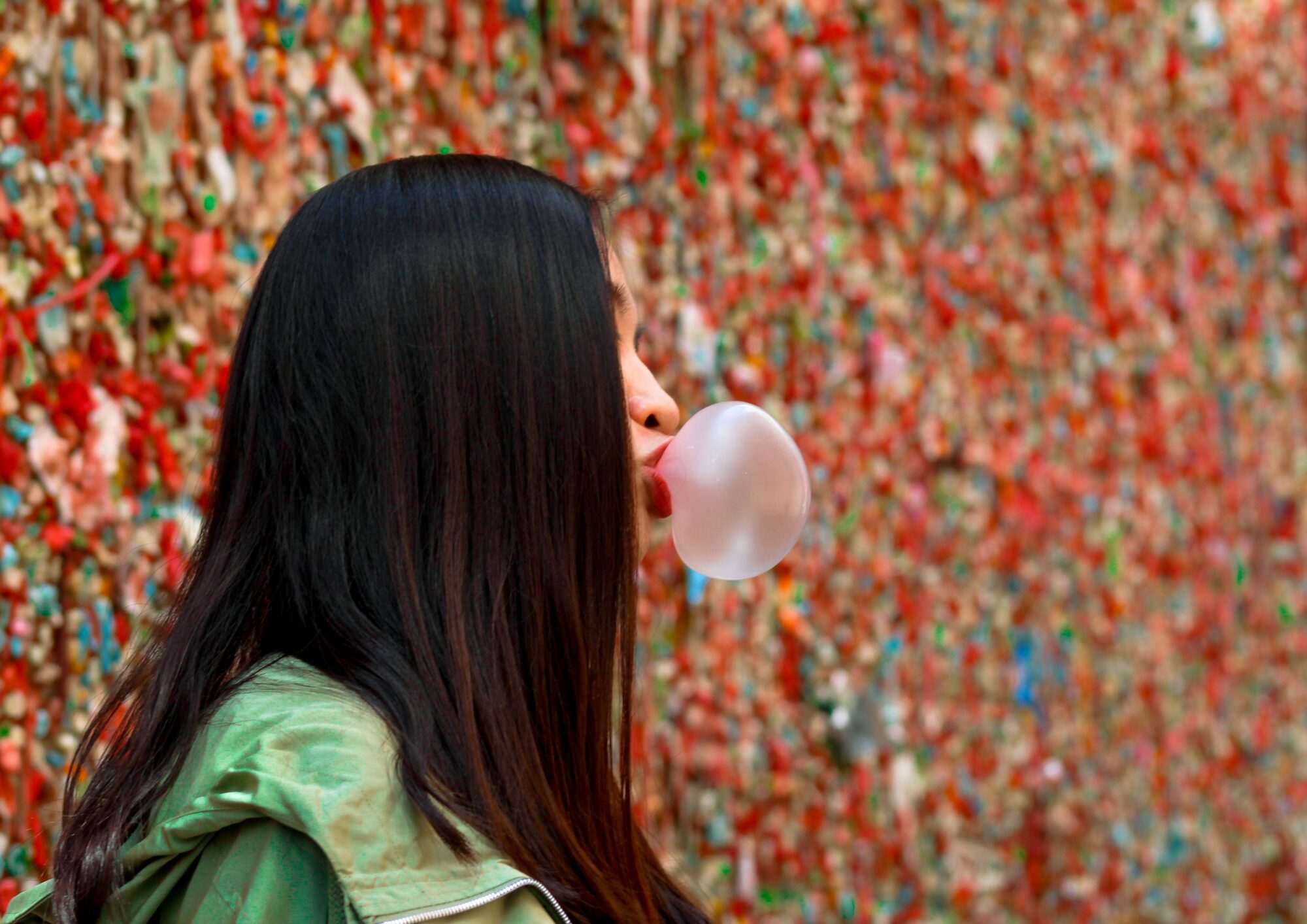 girl blowing bubble gum