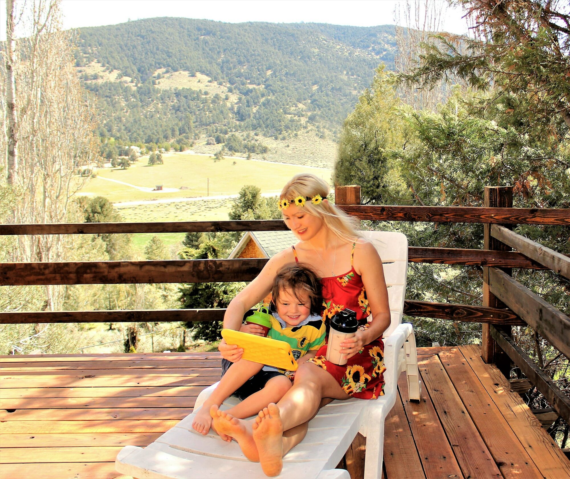 woman and child sitting outside with shakes