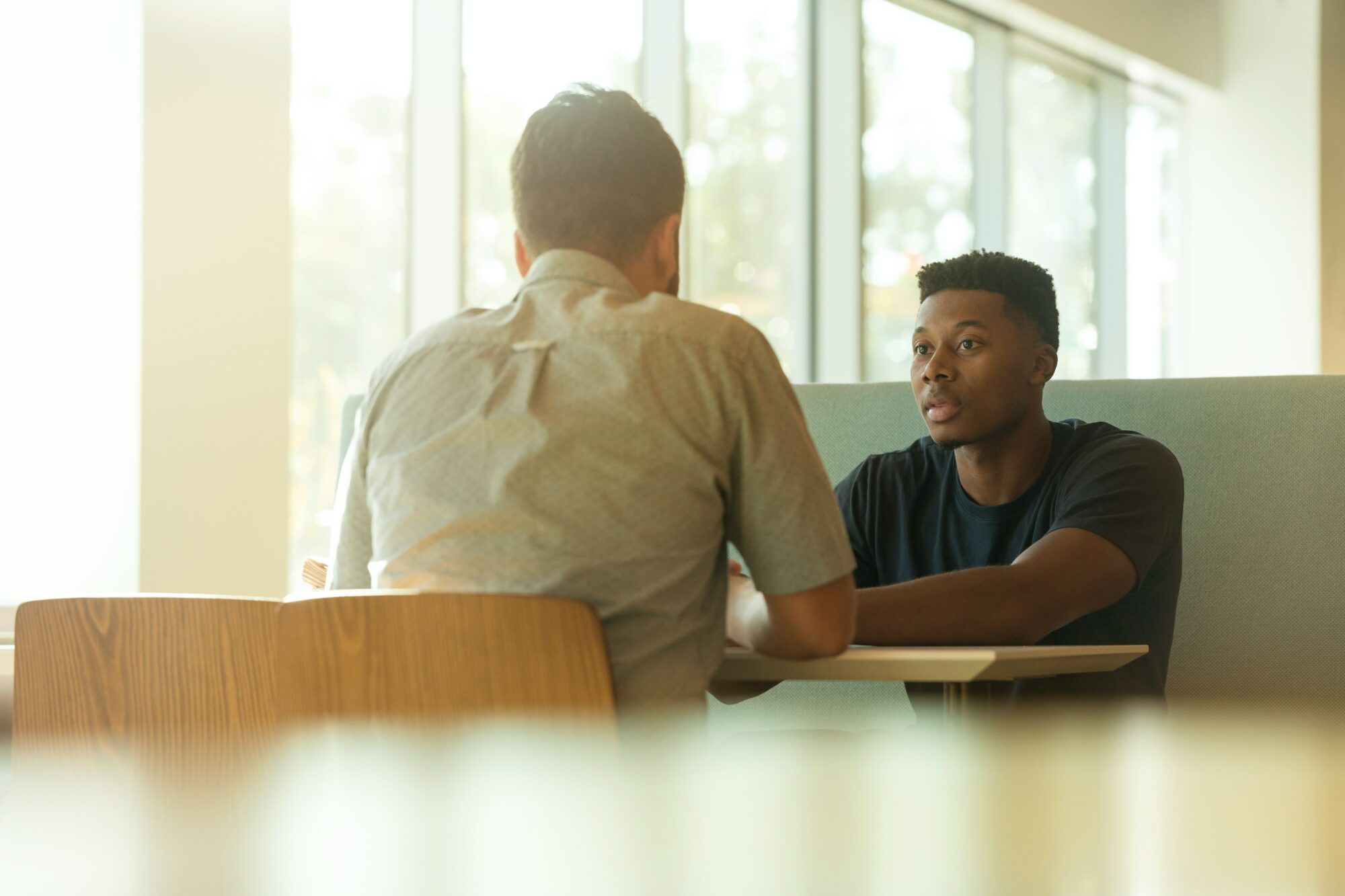 men talking at table