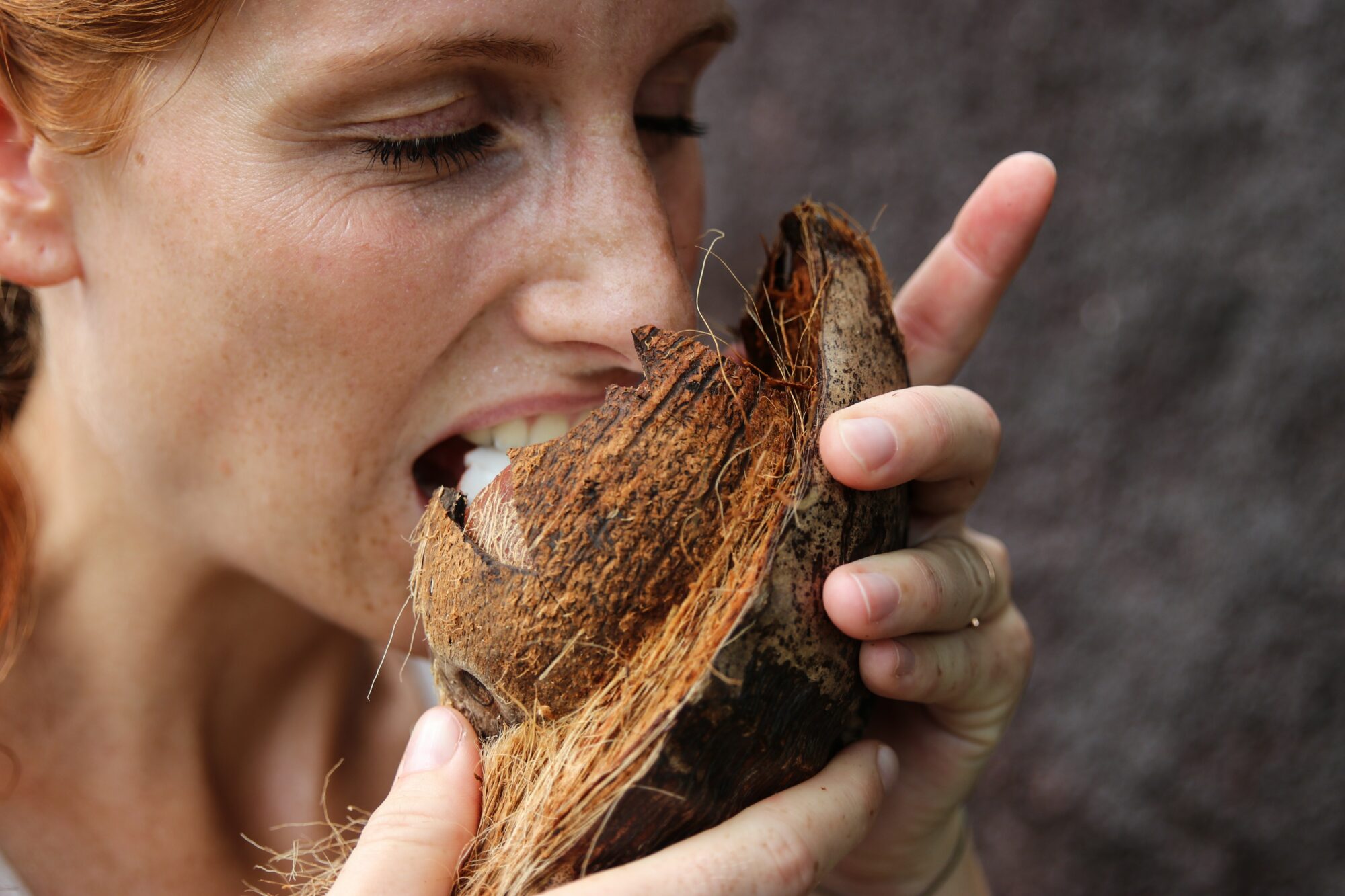 woman eating coconut