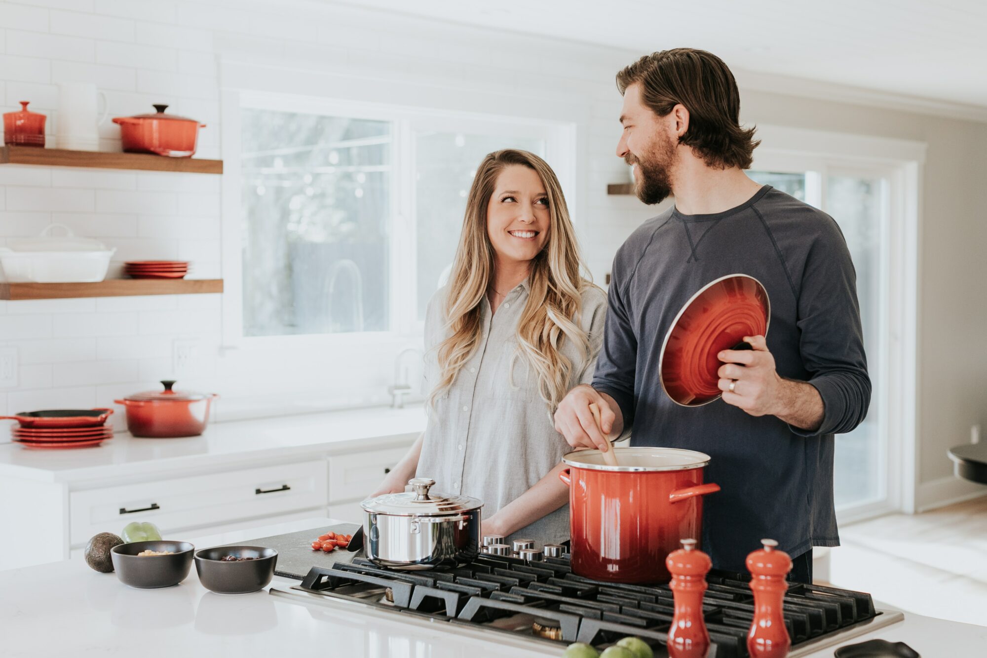 couple smiling in the kitchen