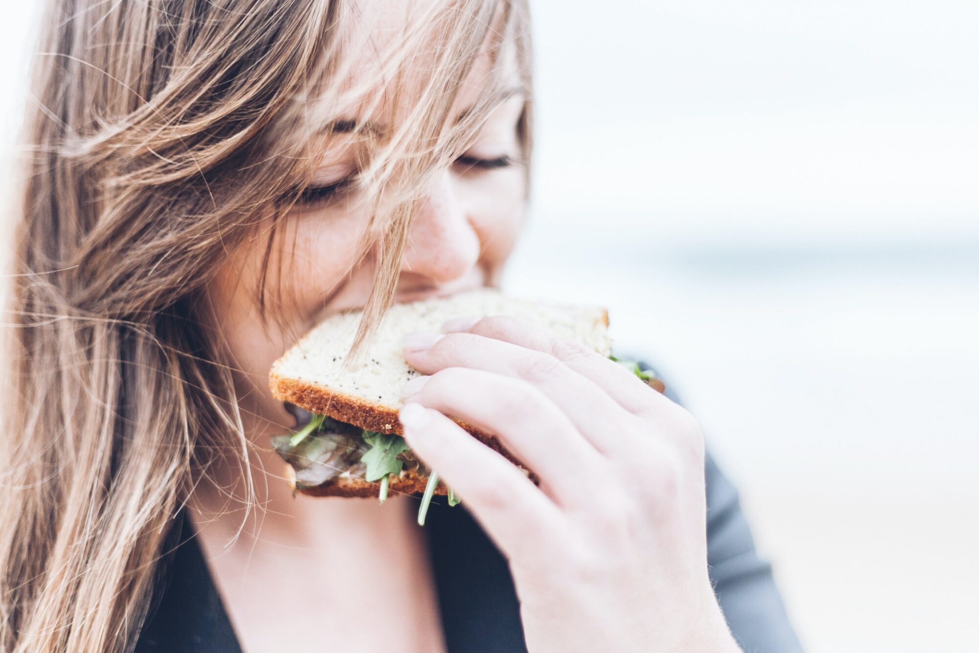 woman eating a sandwich