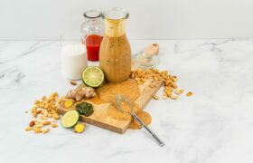 Cutting board and 3 bottles on a table