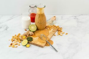 Cutting board and 3 bottles on a table