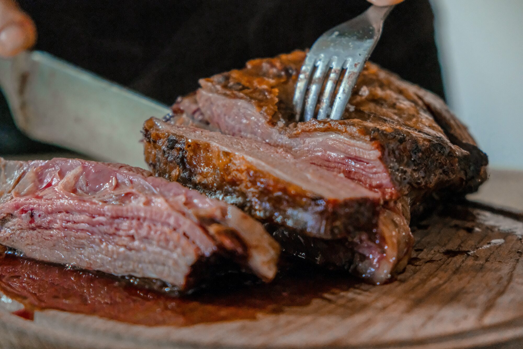 cutting into steak