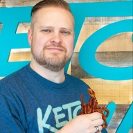 Chris Bair holding bacon