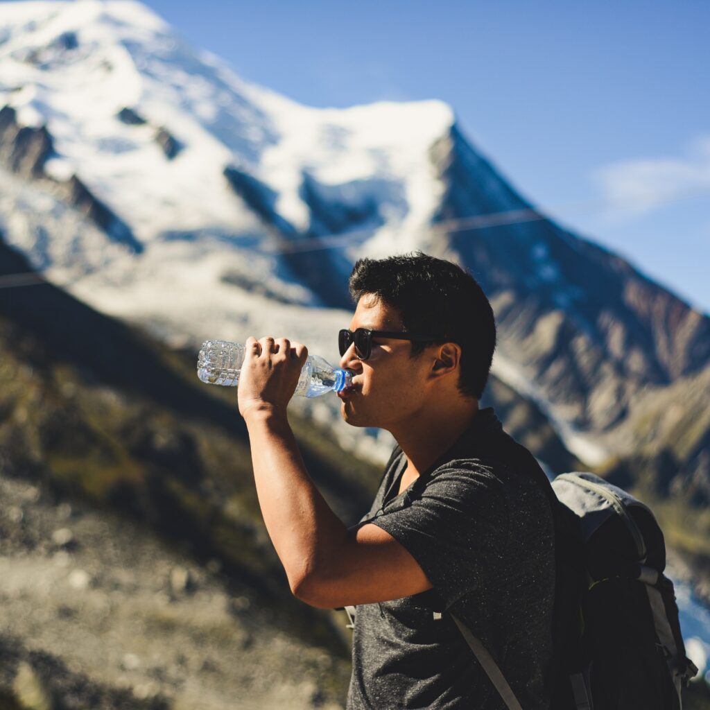 drinking water while hiking