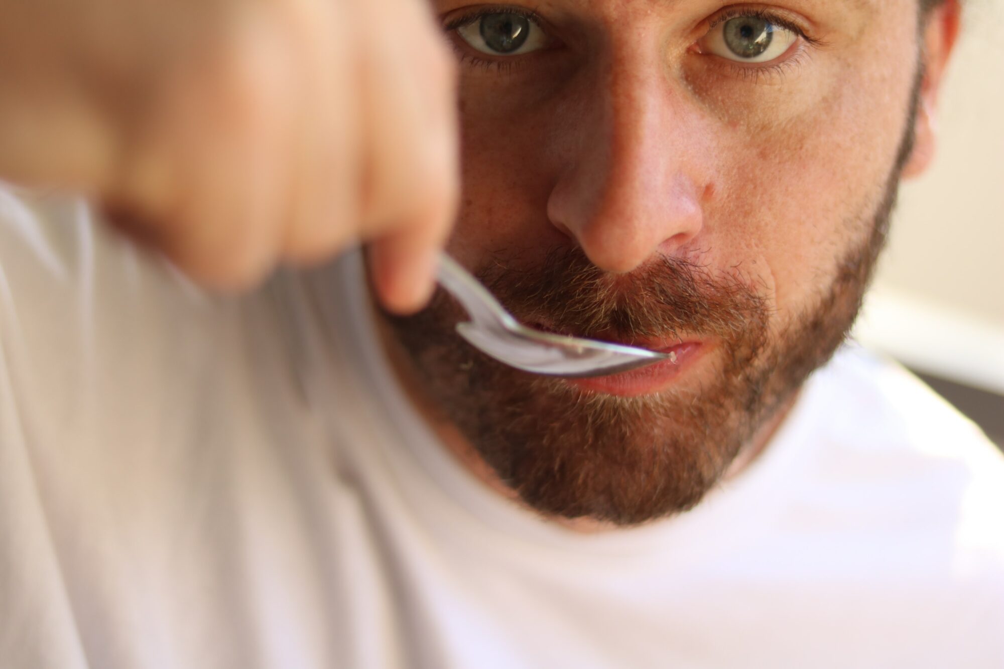 man using spoon