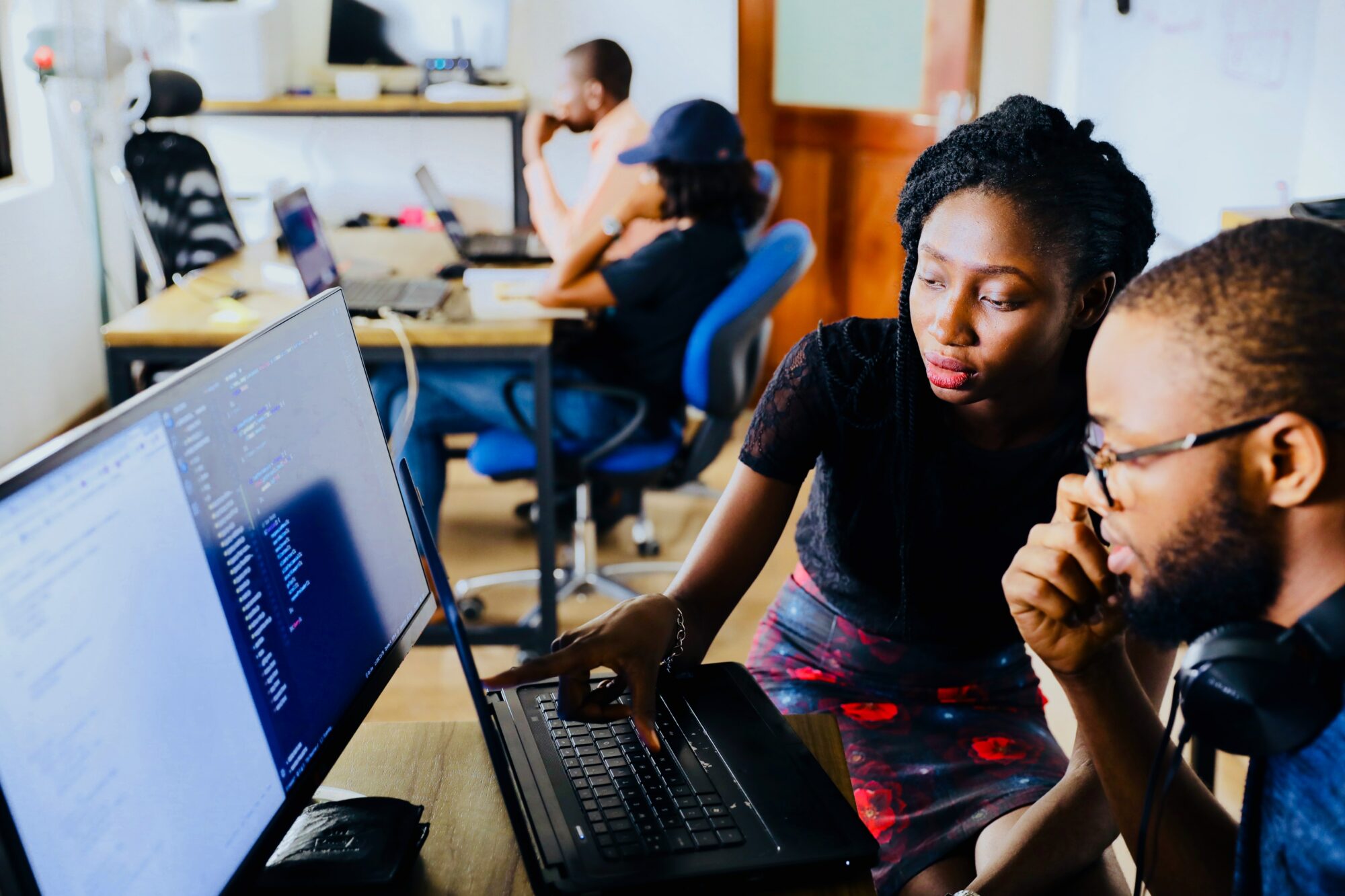 people looking at computer