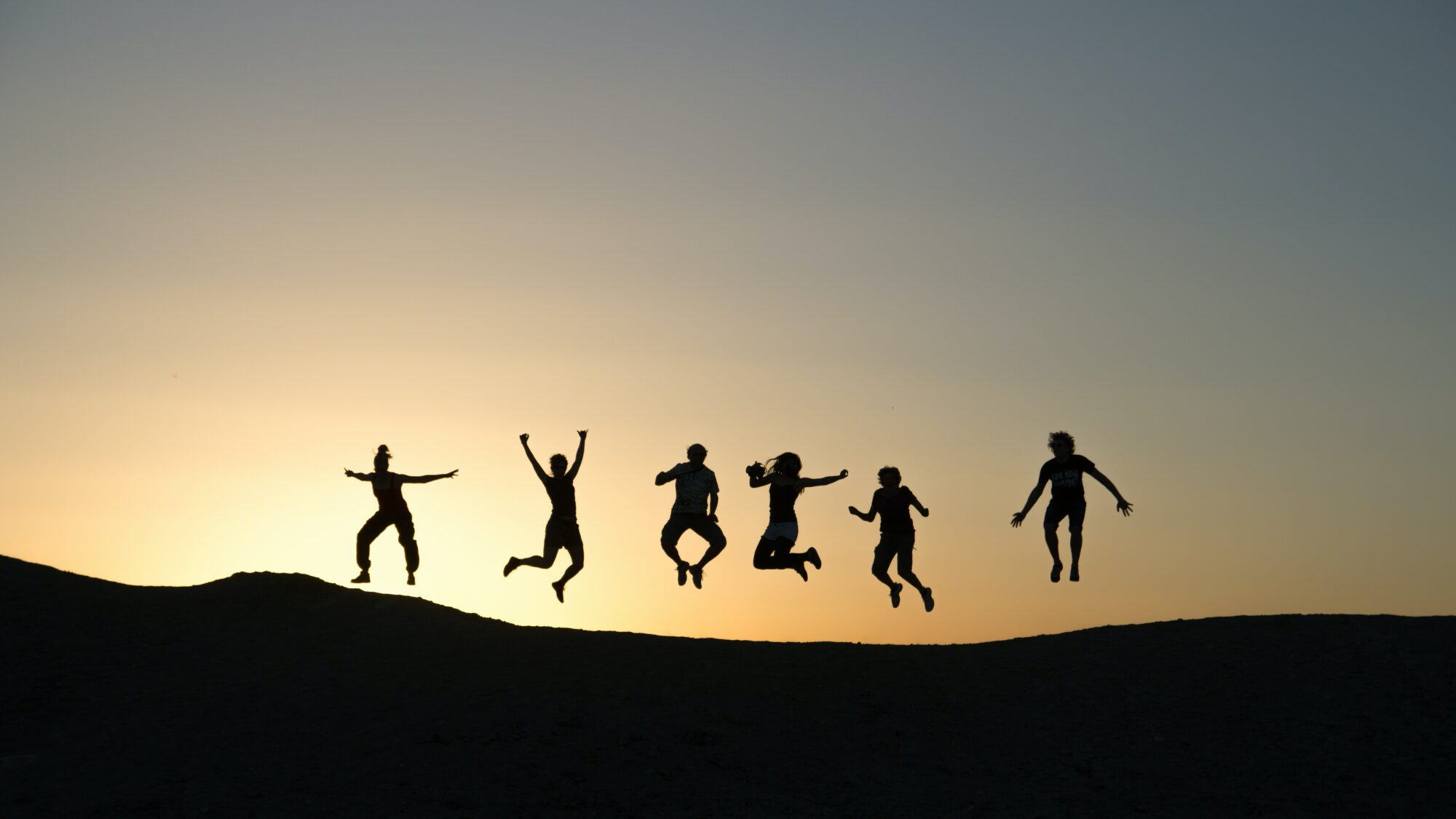 jumping with sunset in background