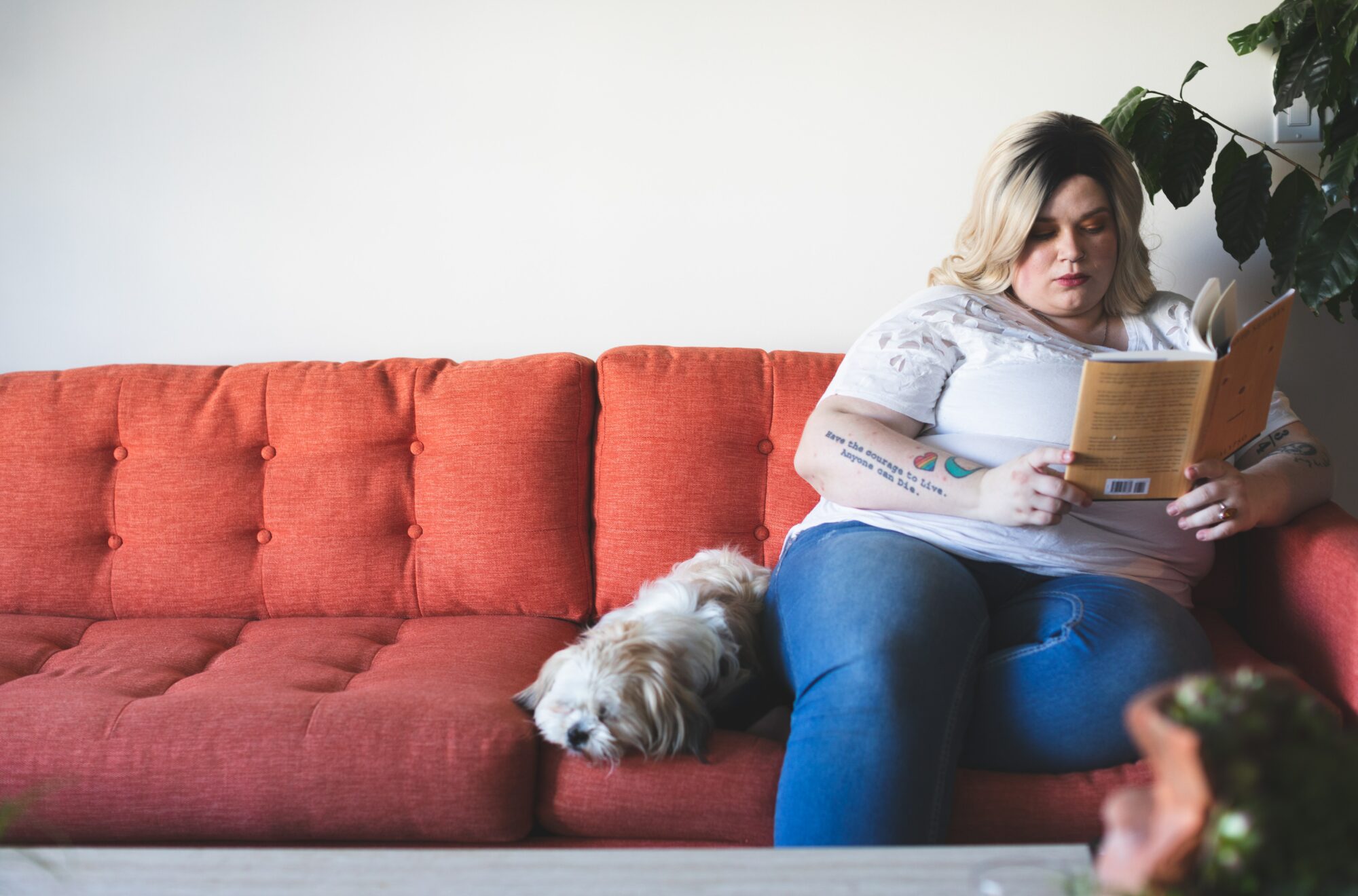 woman sitting next to dog