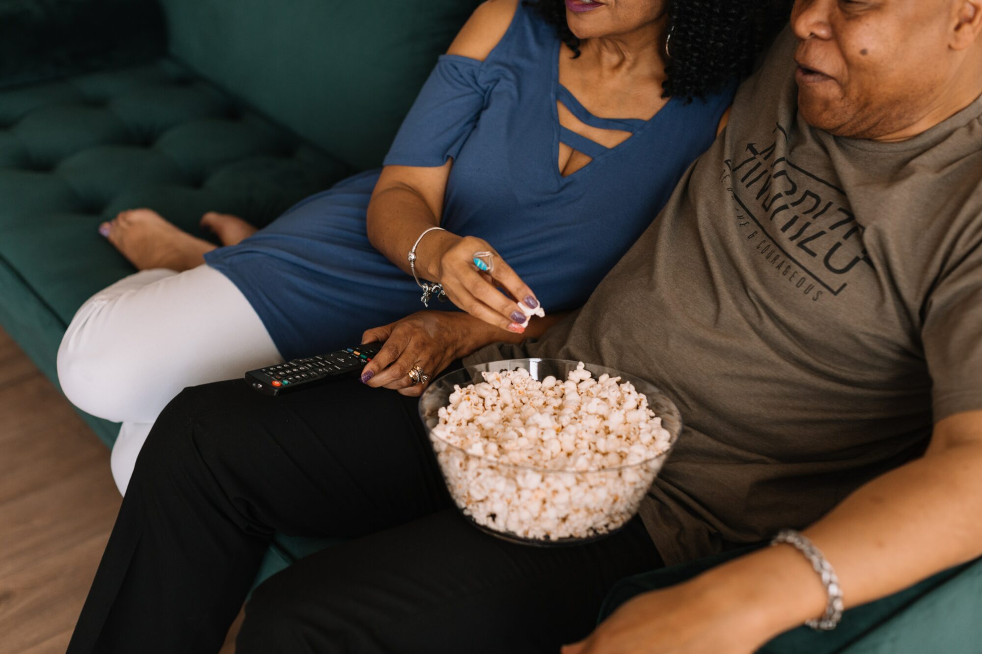 couple eating popcorn and watching movie