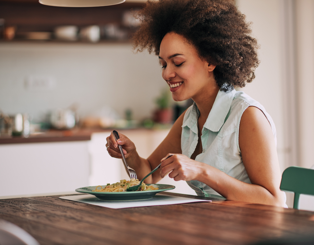 woman eating pasta