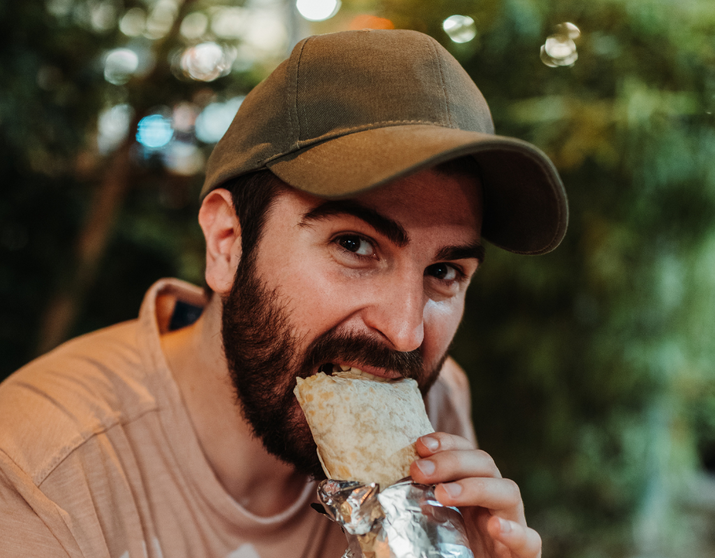 man eating burrito