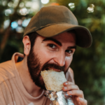 man eating burrito