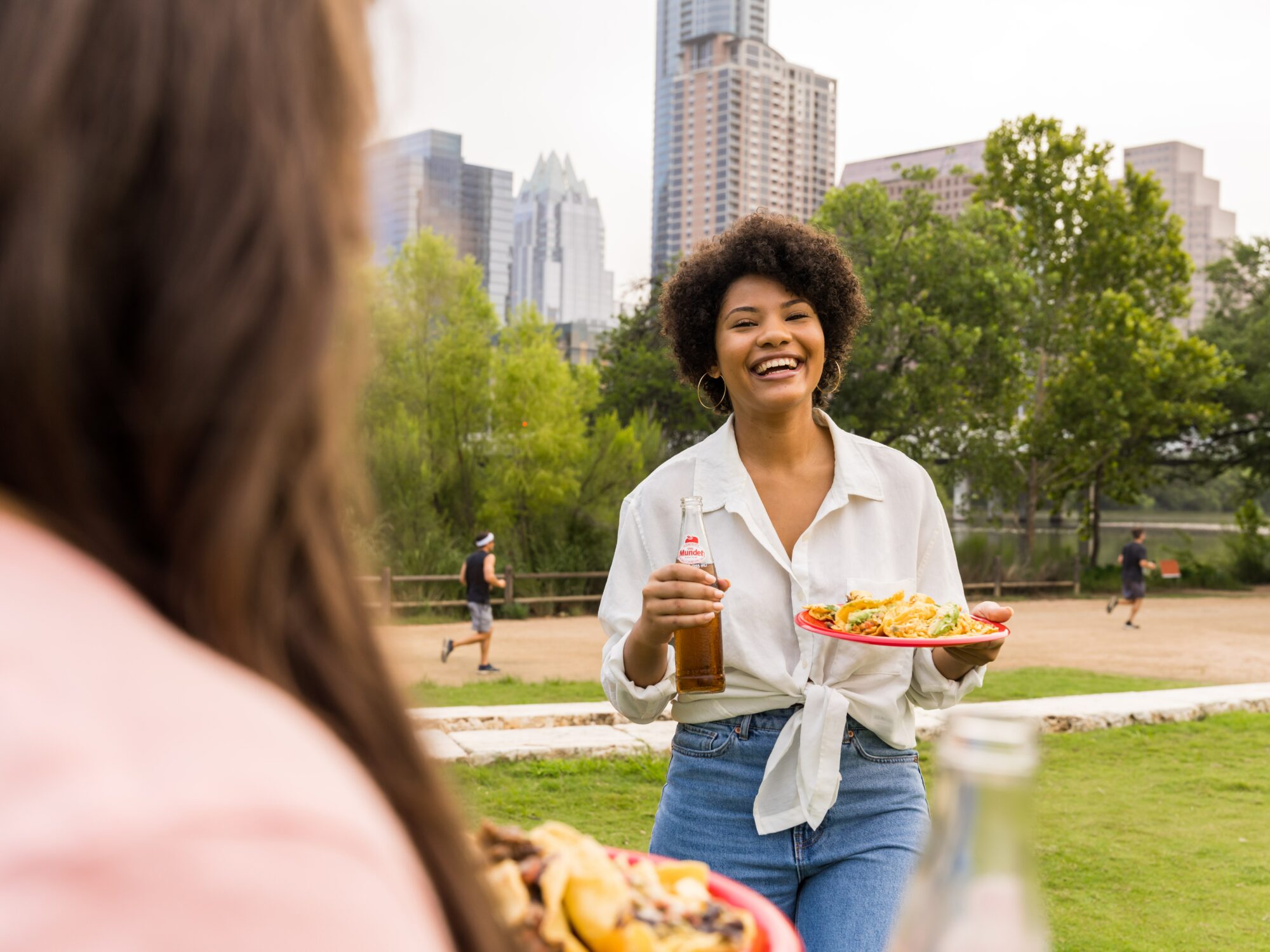 woman holding tacos