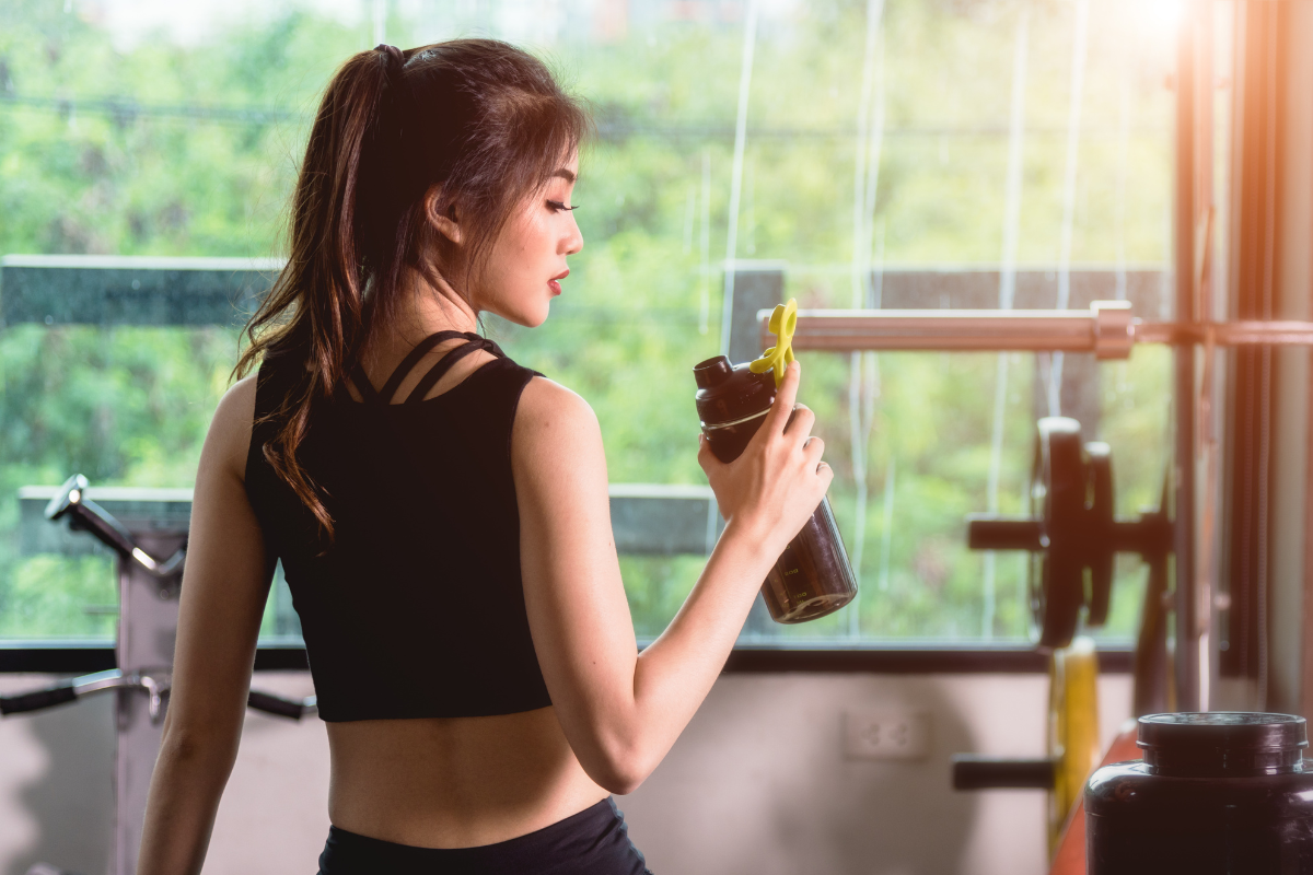 woman drinking during a workout