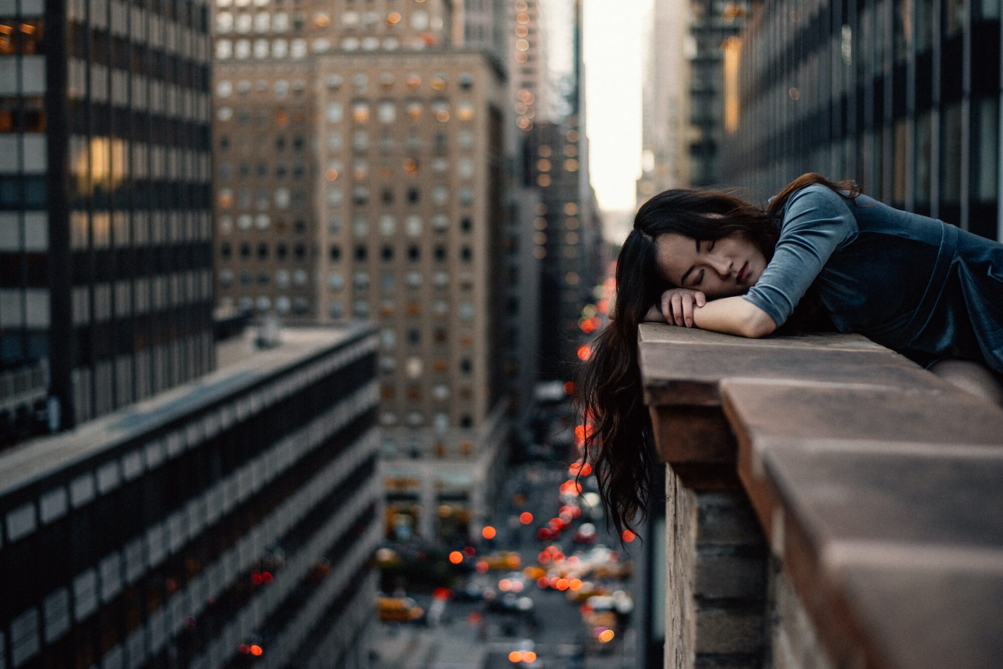 woman resting on balcony