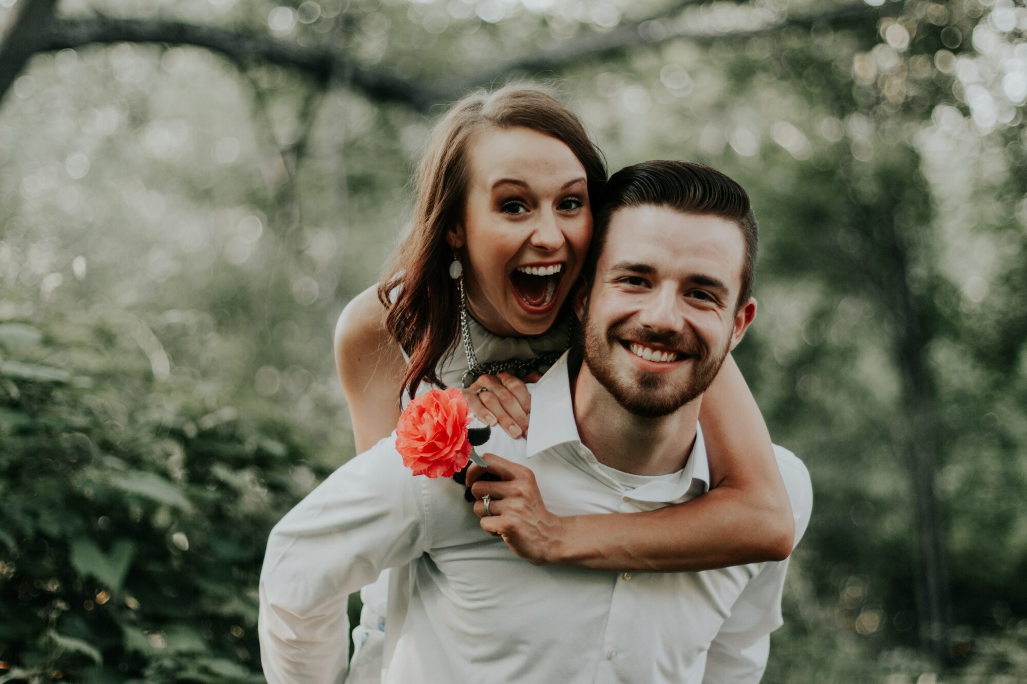 couple smiling with flower