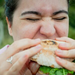 woman eating a sandwich