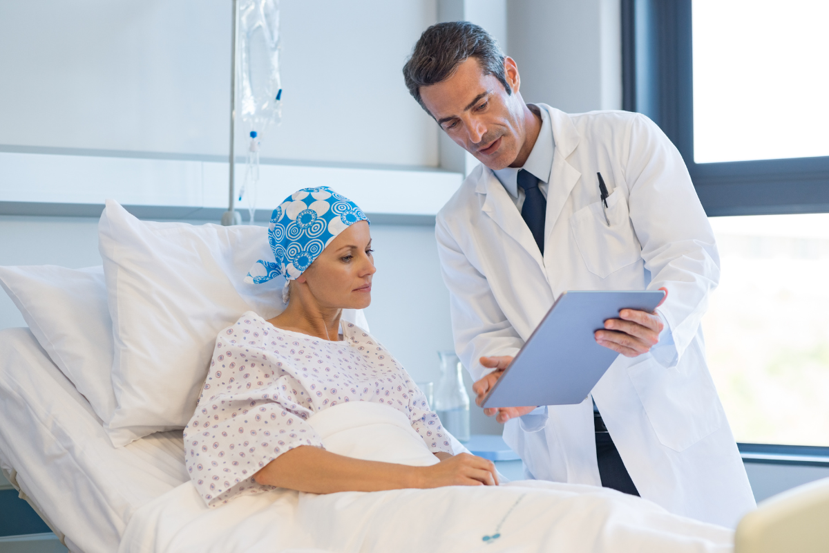 doctor talking to cancer patient