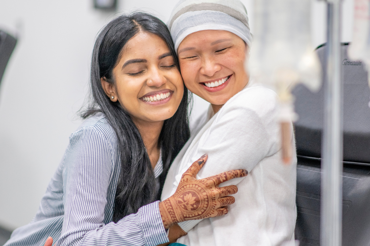 women hugging in hospital