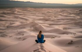 woman sitting in sand