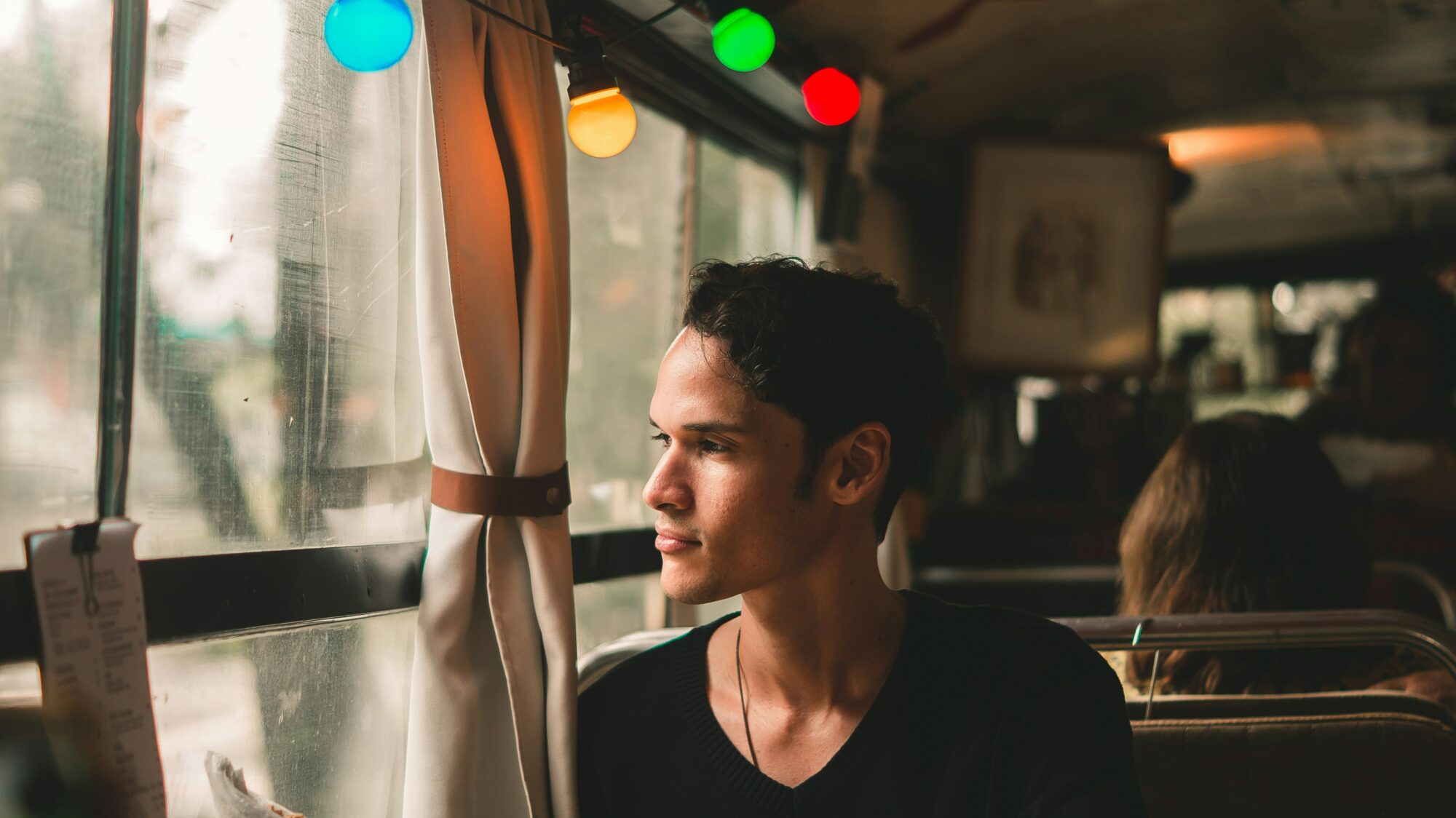 man looking outside diner