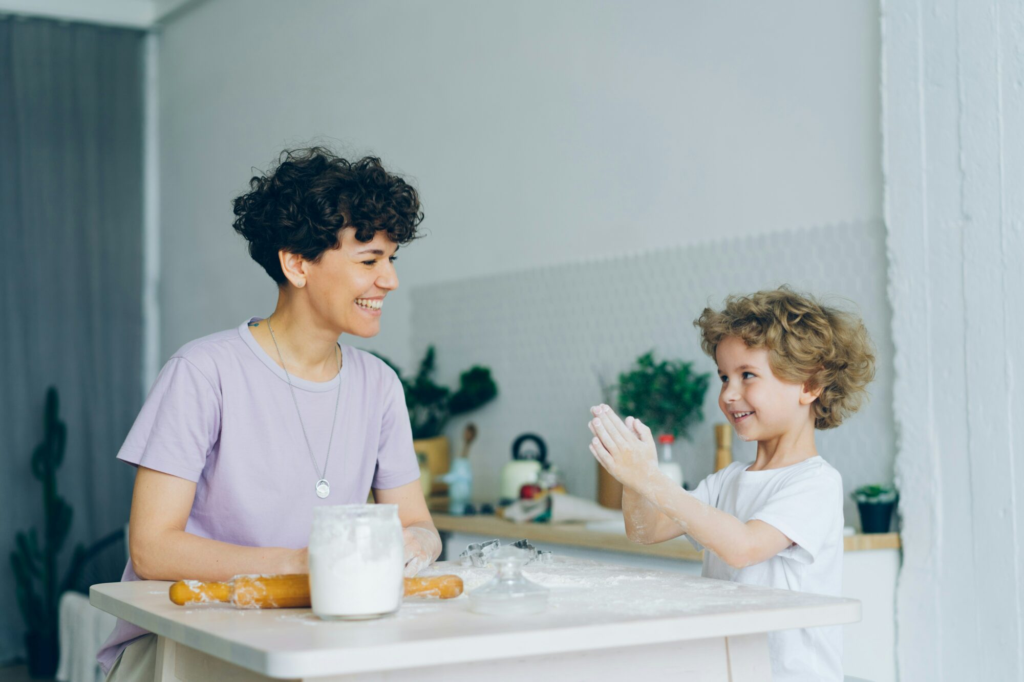 woman baking with child