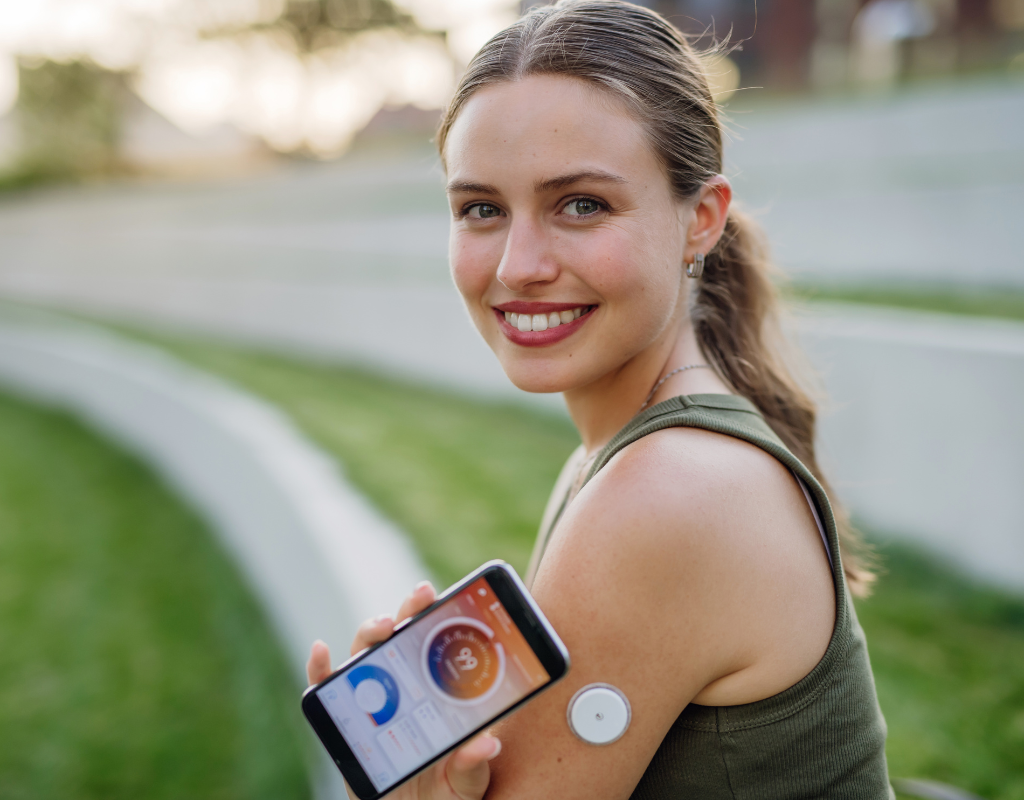 woman wearing cgm device