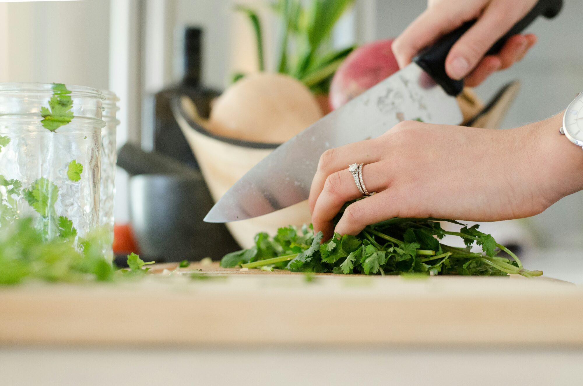 person cutting cilantro