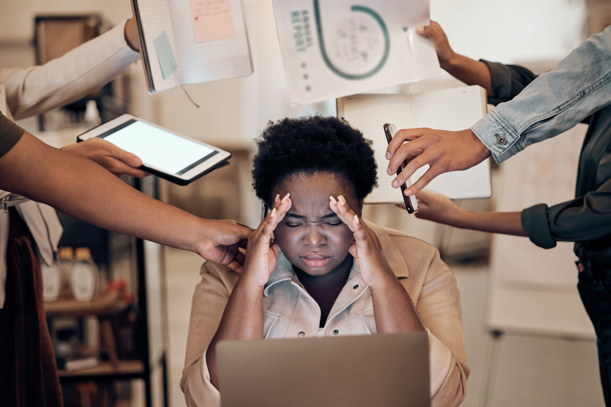 Stress, headache and multitasking. Woman with anxiety and burnout amid many demands.